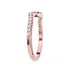 Rose gold ring with diamonds on a white background
