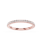 Rose gold ring with diamonds on a white background