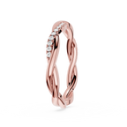 Rose gold ring with diamond accents on a white background