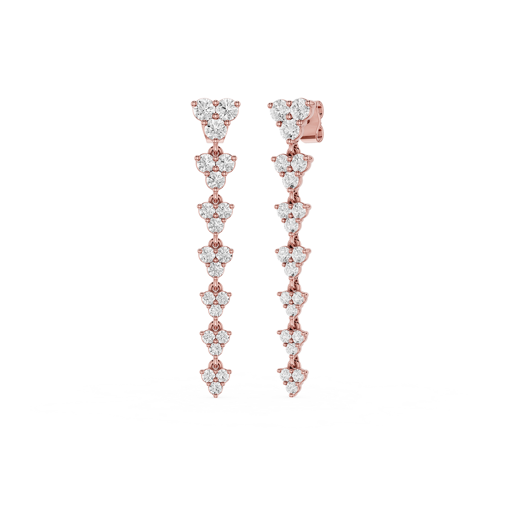 Rose gold and diamond earrings on a white background