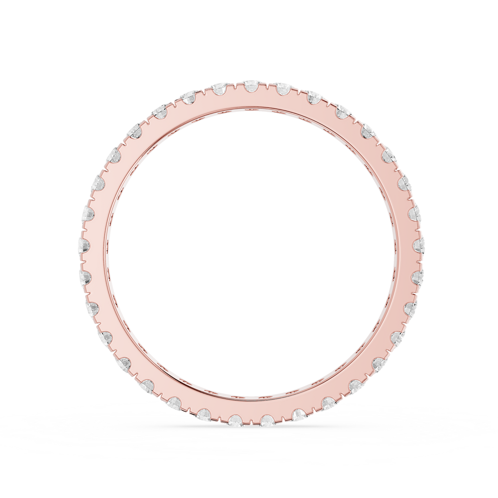 Rose gold ring with small stones on a white background