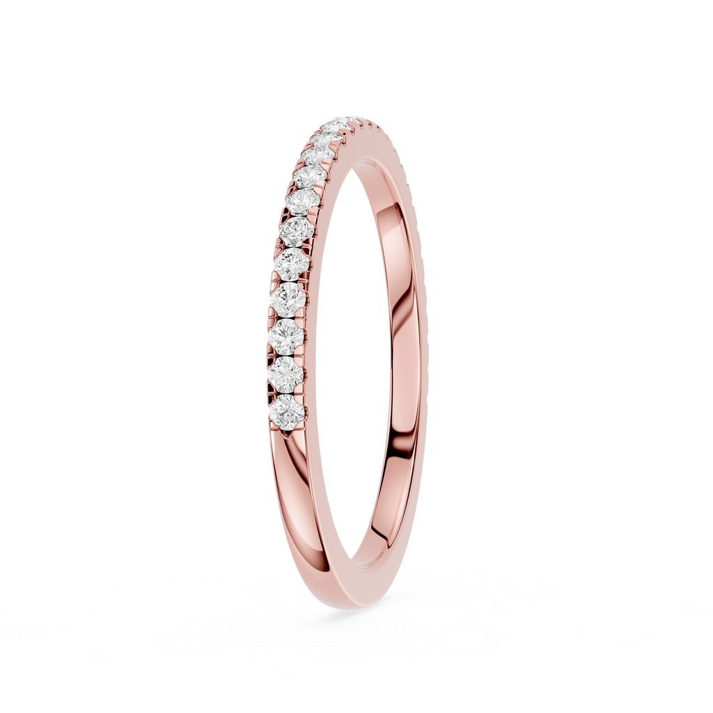 Rose gold ring with small diamonds on a white background