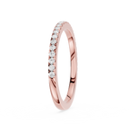 Rose gold ring with small diamonds on a white background