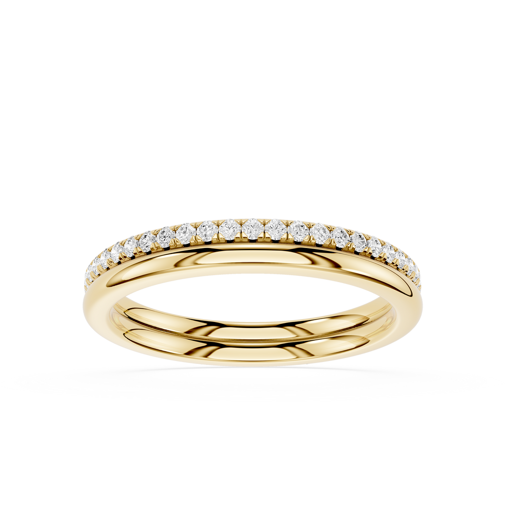 A yellow gold eternity ring featuring a single row of round-cut clear gemstones set along the top half of the band, shown against a plain white background.