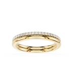 A yellow gold eternity ring featuring a single row of round-cut clear gemstones set along the top half of the band, shown against a plain white background.