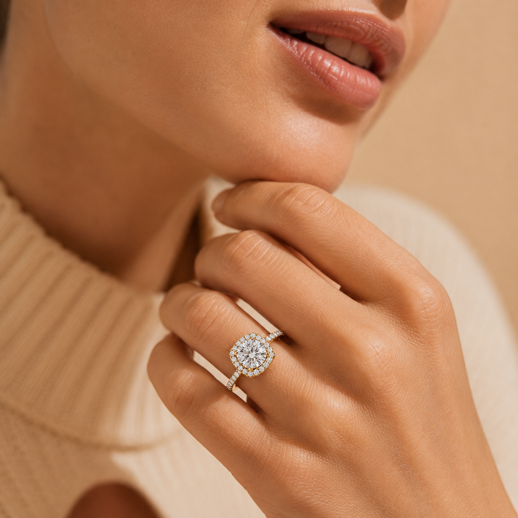Close-up of a hand wearing a diamond ring with a blurred background