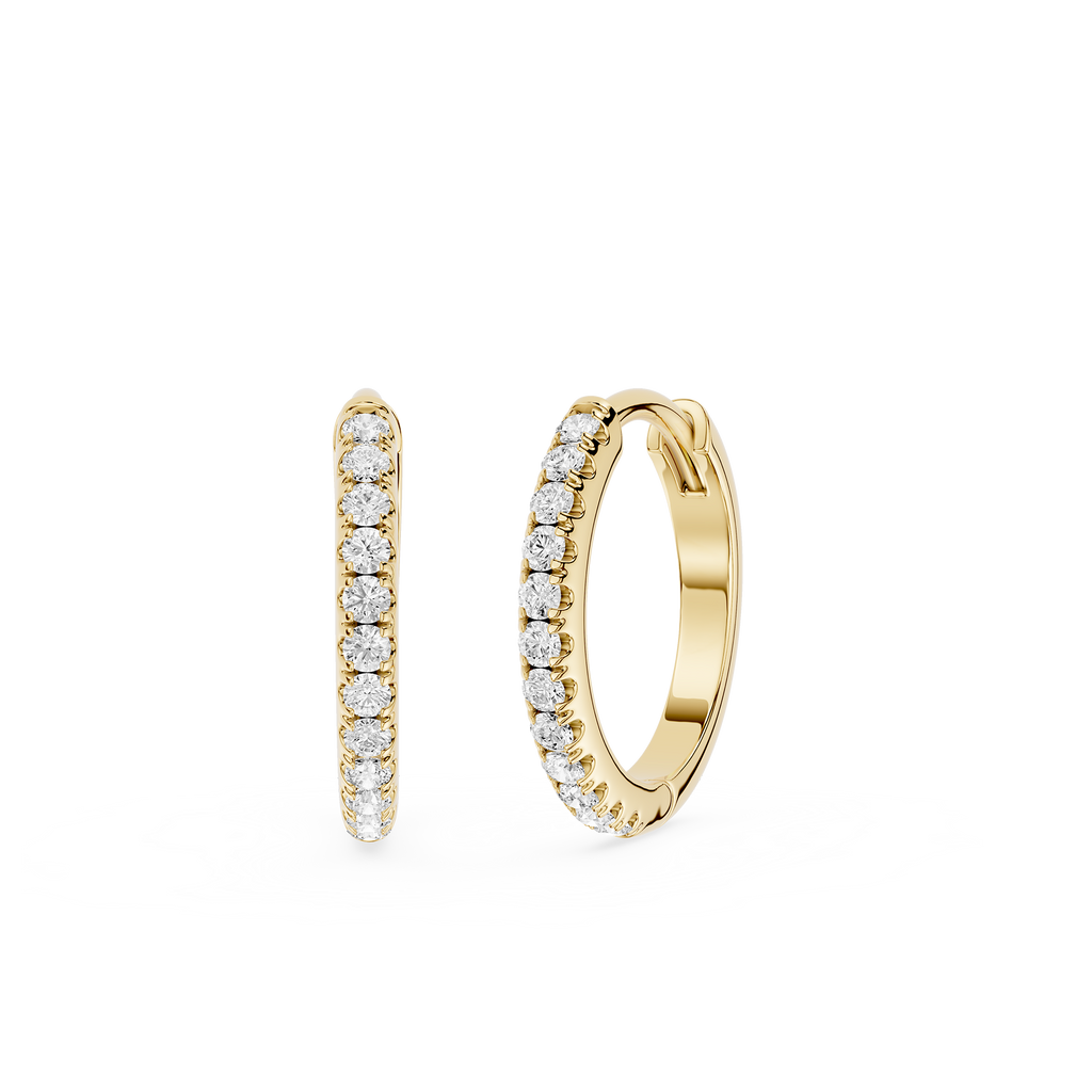 Gold hoop earrings with embedded diamonds on a white background