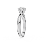 Silver ring with a diamond on a white background