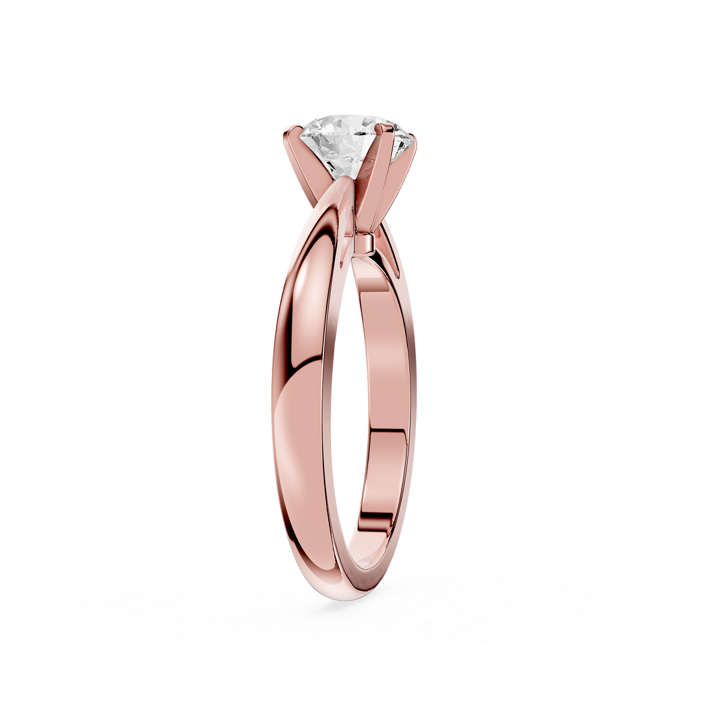 Rose gold ring with a diamond on a white background