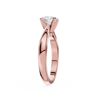Rose gold ring with a diamond on a white background