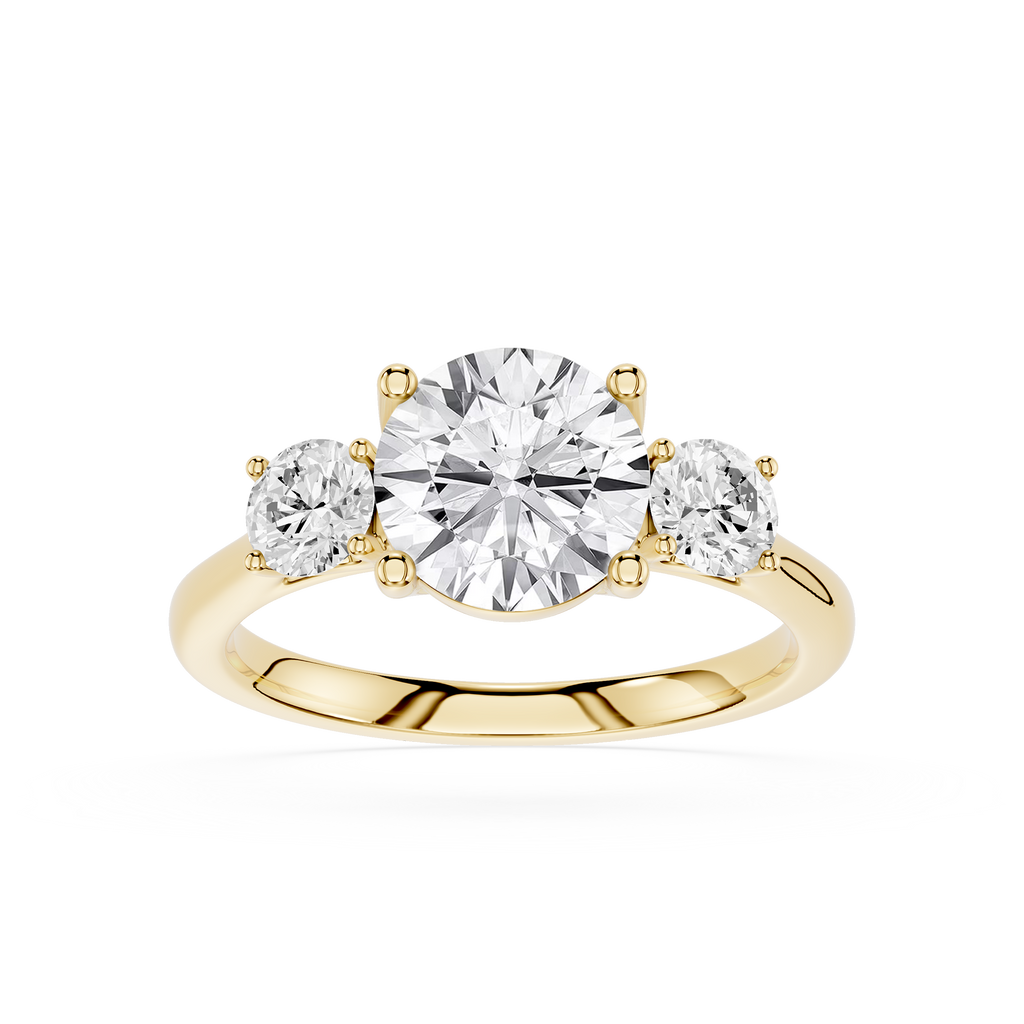 Gold ring with three diamonds on a white background