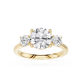 Gold ring with three diamonds on a white background