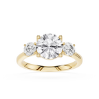 Gold ring with three diamonds on a white background