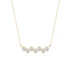 Gold necklace with diamond-like stones on a white background