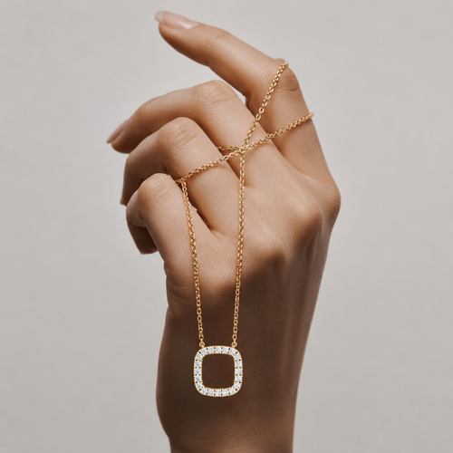 Shop a round cut lab grown diamond cushion pendant featuring a modern open-frame design. IGI certified diamonds set in 14K or 18K gold.