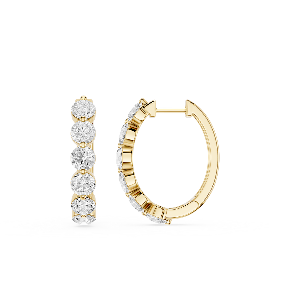 Gold hoop earrings with diamond accents on a white background