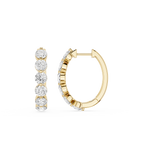 Gold hoop earrings with diamond accents on a white background