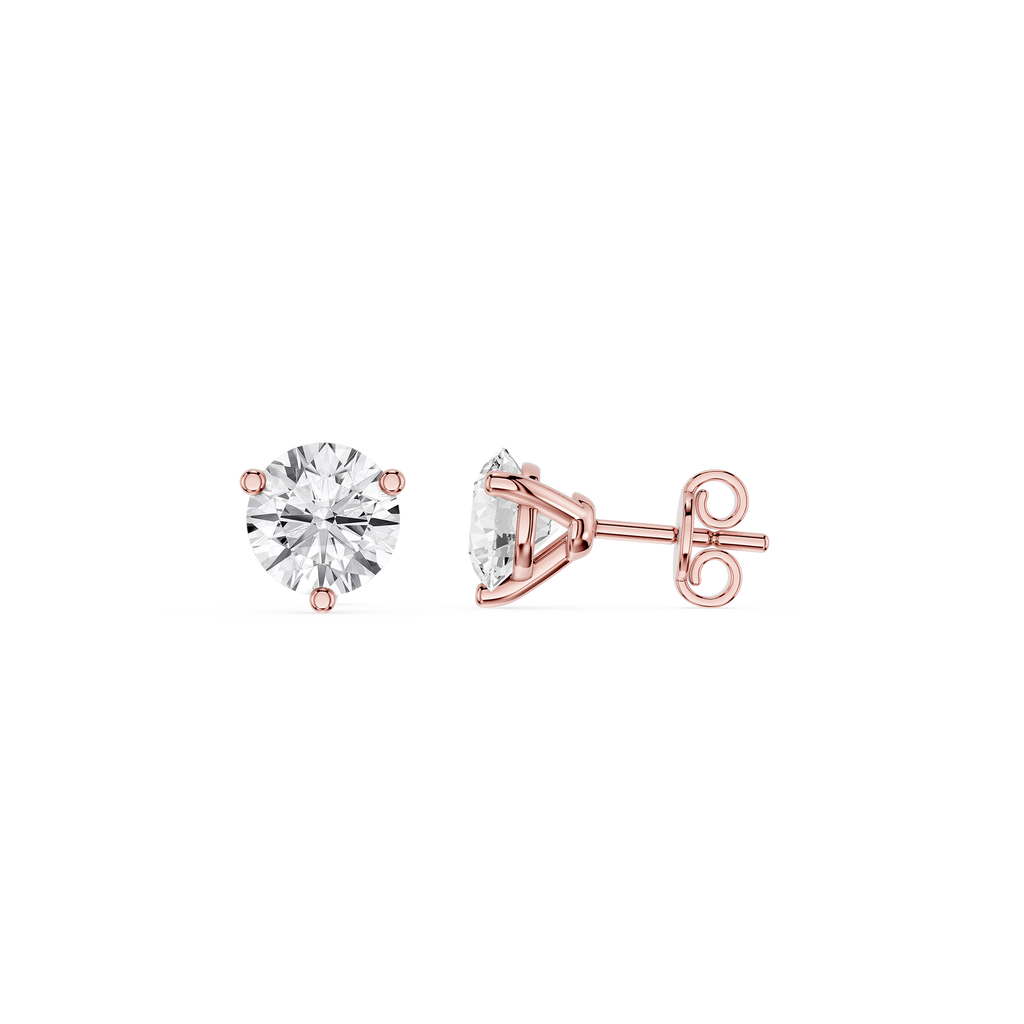 Rose gold stud earrings with clear gemstones on a white background