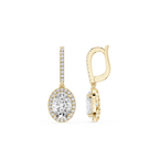 Gold earrings with clear gemstones on a white background