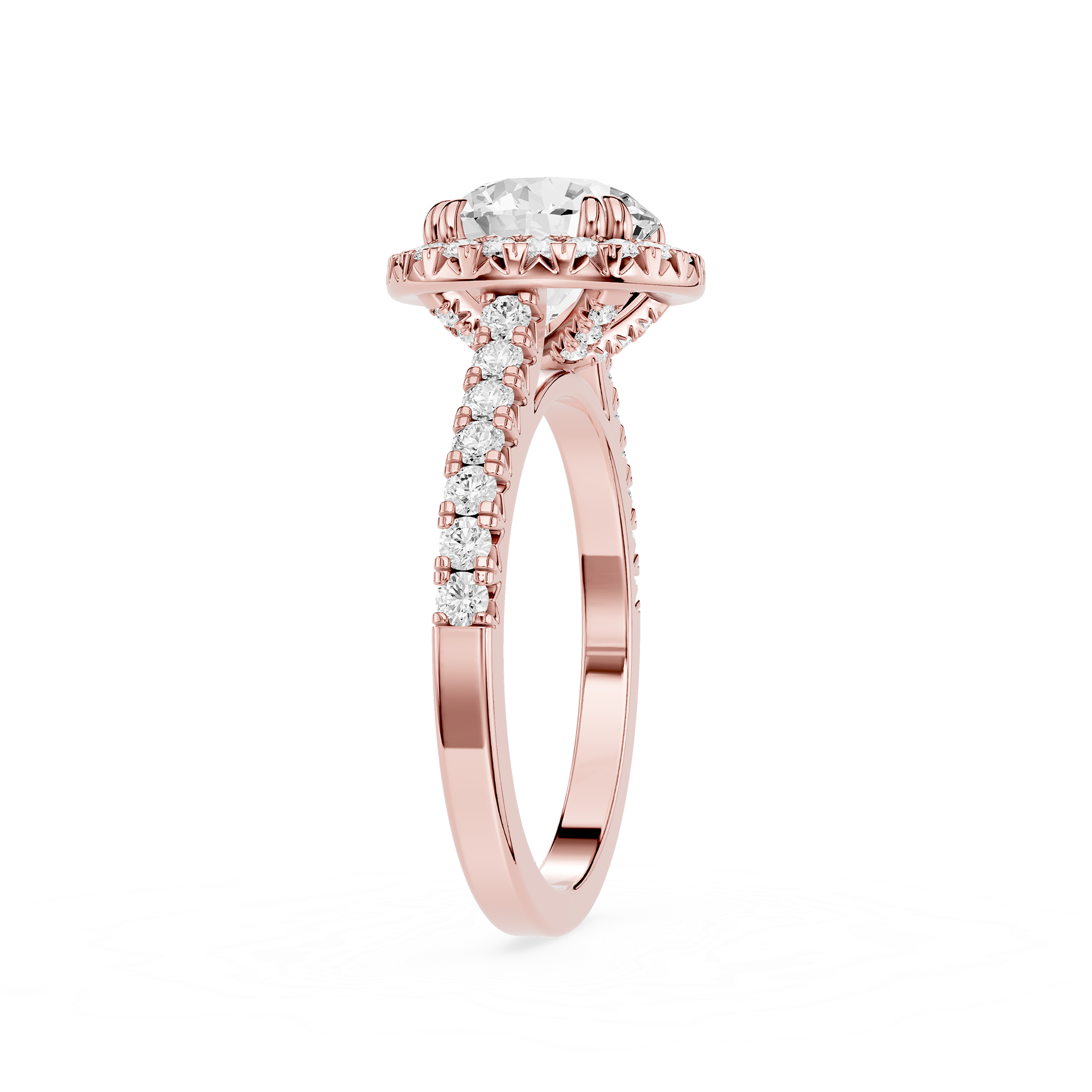 A rose gold engagement ring featuring a round-cut diamond center stone in a halo setting, with pave diamonds along the shank, shown on a plain white background.