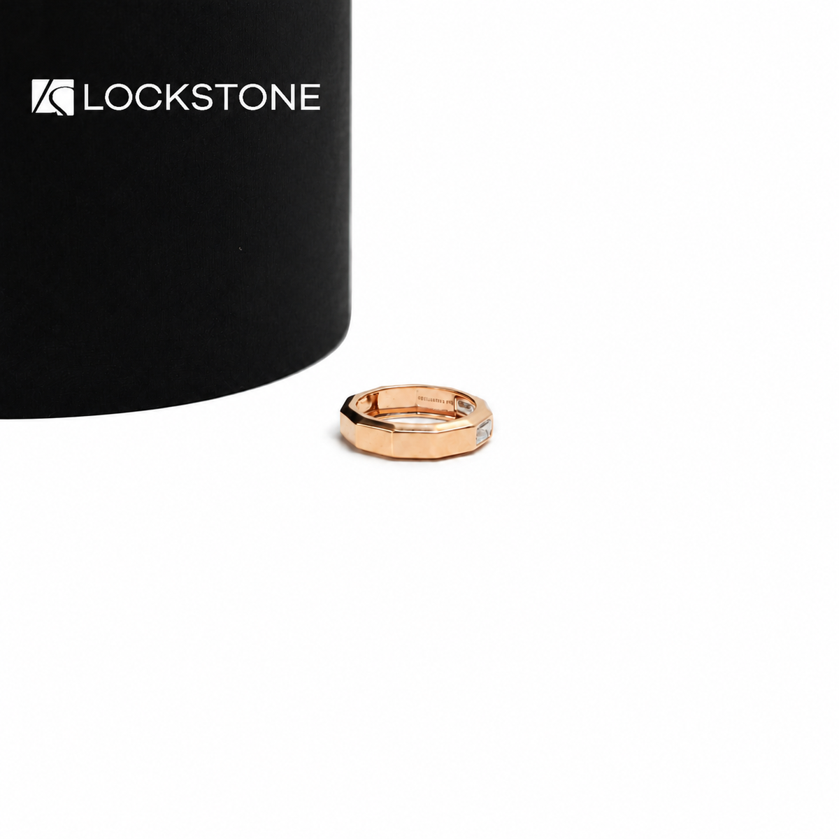 Geometric rose gold diamond statement ring showcasing flush set rectangular step cut stones and beveled metal edges
