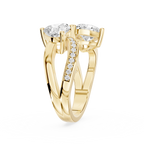 Double heart diamond ring in yellow gold showcasing an asymmetrical two stone setting with curved diamond accented shoulders mvp:YG:02
