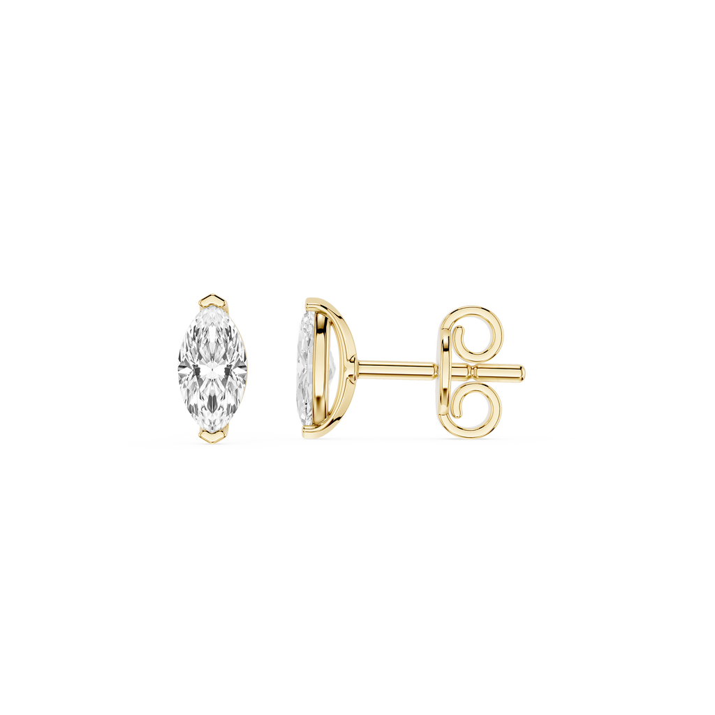 Gold earrings with clear gemstones on a white background