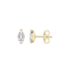 Gold earrings with clear gemstones on a white background