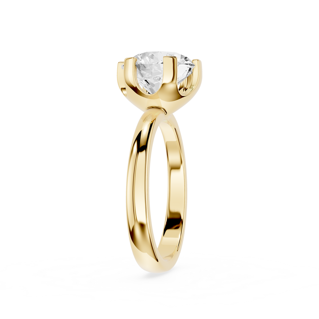 Gold ring with a clear gemstone on a white background