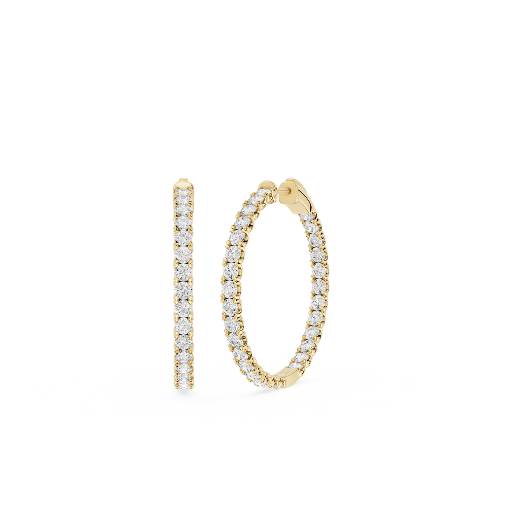 Gold hoop earrings with diamond accents on a white background
