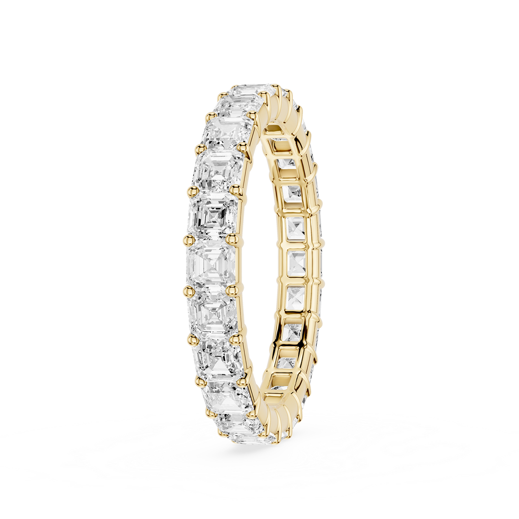 A rose gold eternity ring featuring a continuous row of clear baguette-cut gemstones, shown on a clean white background.