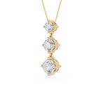 Gold necklace with three diamond pendants on a white background