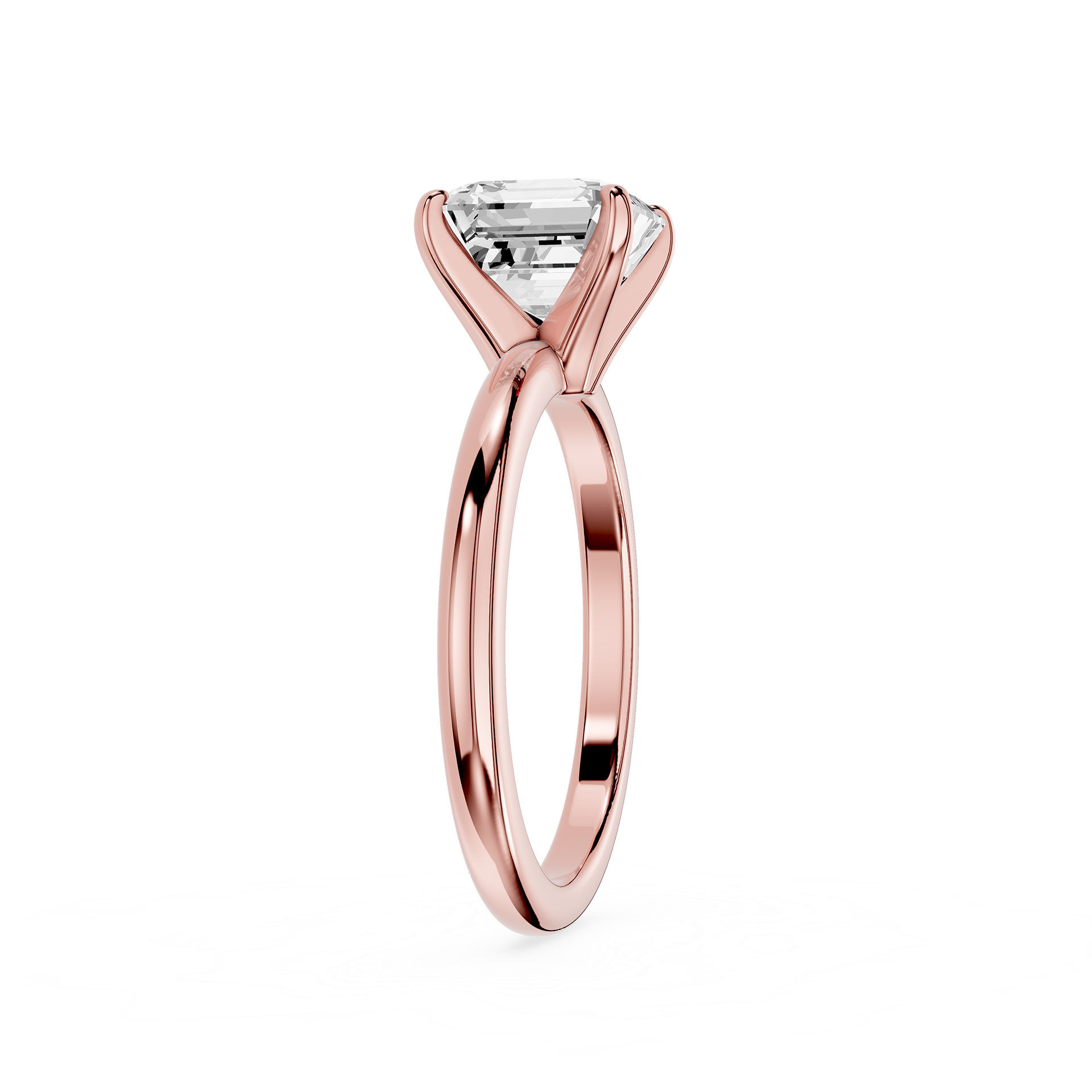 Rose gold ring with a clear gemstone on a white background