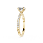 A yellow gold engagement ring featuring a large rectangular emerald-cut diamond center stone and a pavé band set with small round diamonds, shown on a plain white background.