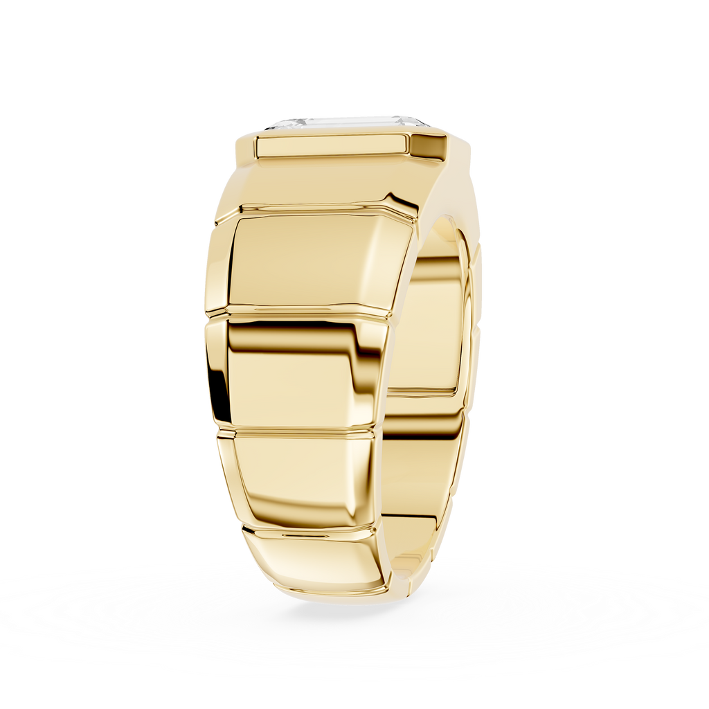 Gold ring with geometric design on a white background
