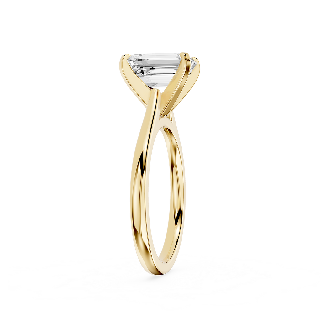 Gold ring with a diamond on a white background