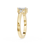 Gold ring with a diamond on a white background