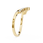 Gold ring with diamond accents on a white background