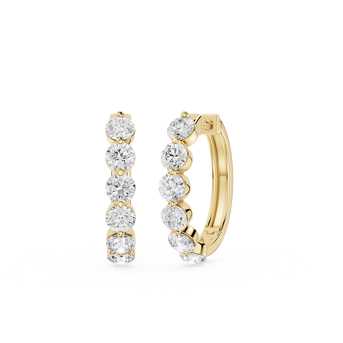 Gold hoop earrings with clear gemstones on a white background