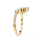 Gold ring with diamond accents on a white background