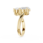 Yellow gold ring with two diamonds on a white background