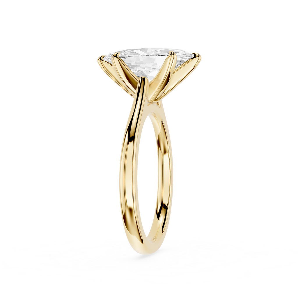 Gold ring with a clear gemstone on a white background