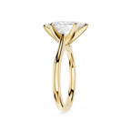Gold ring with a clear gemstone on a white background