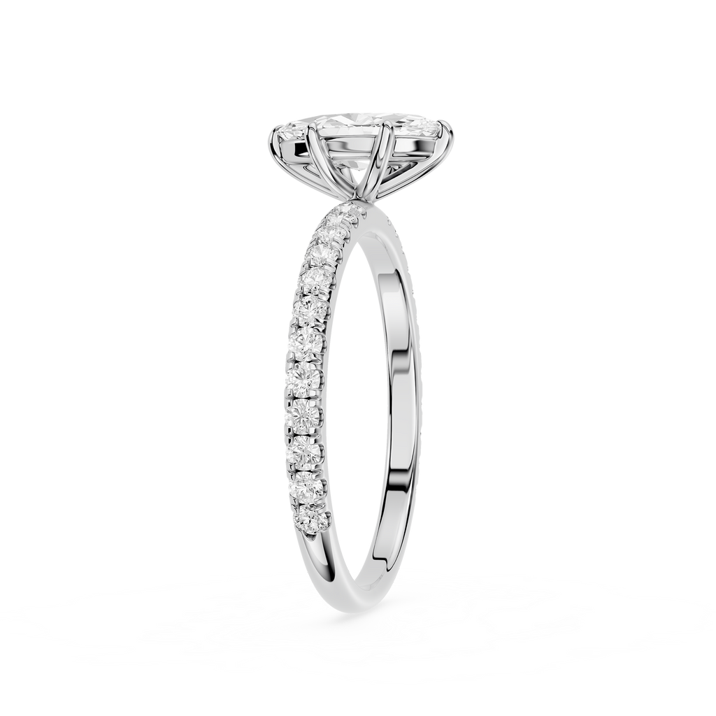 Diamond ring with a central stone and smaller stones on the band against a white background
