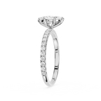 Diamond ring with a central stone and smaller stones on the band against a white background