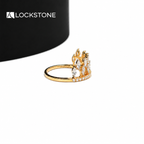 Marquise shaped diamonds form a pointed tiara pattern on this yellow gold statement ring with small round diamond accents