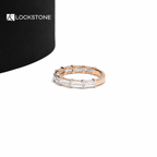 Rectangular lab grown diamonds sit side by side across a rose gold half eternity band with individual metal prongs