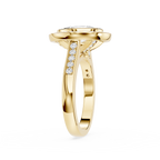Gold ring with diamond accents on a white background
