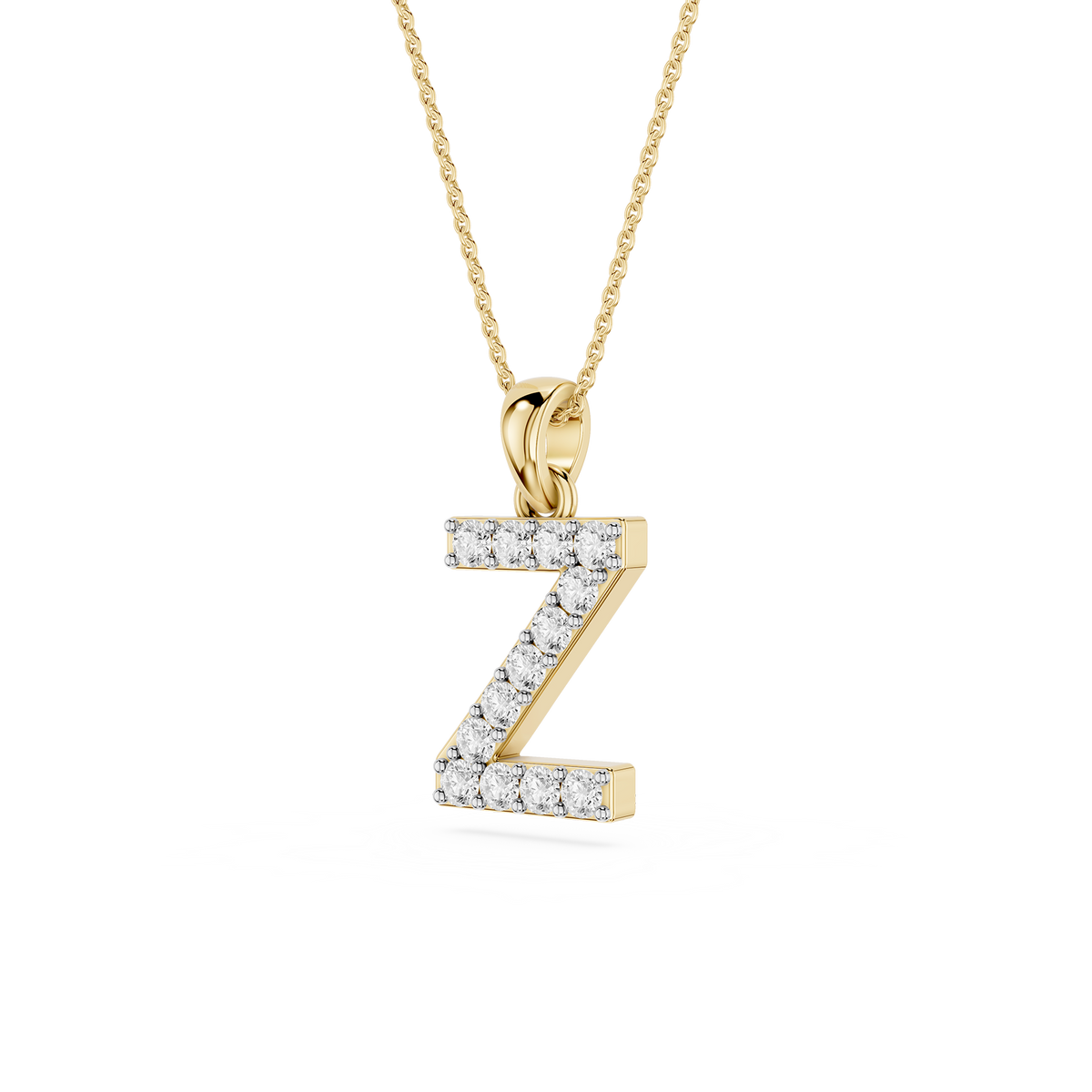 Gold necklace with a 'Z' shaped pendant on a white background