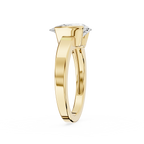 Gold ring with a diamond on a white background